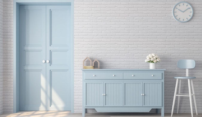 Light blue dresser and door with white background